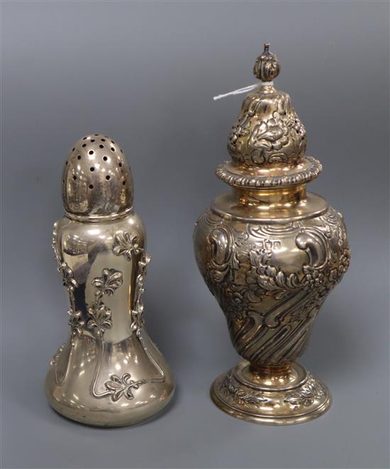 An Edwardian repousse silver sugar caster by Goldsmiths & Silversmiths Co Ltd, London, 1901 and a sterling caster.